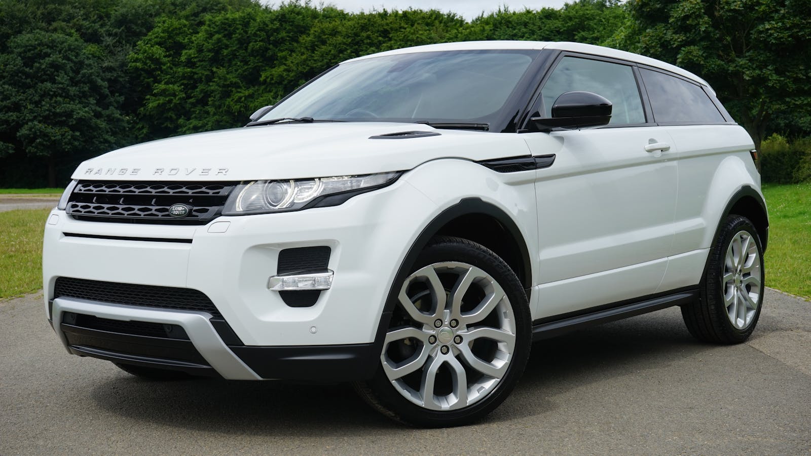 White Land Rover Range Rover Suv on Road, auto insurance